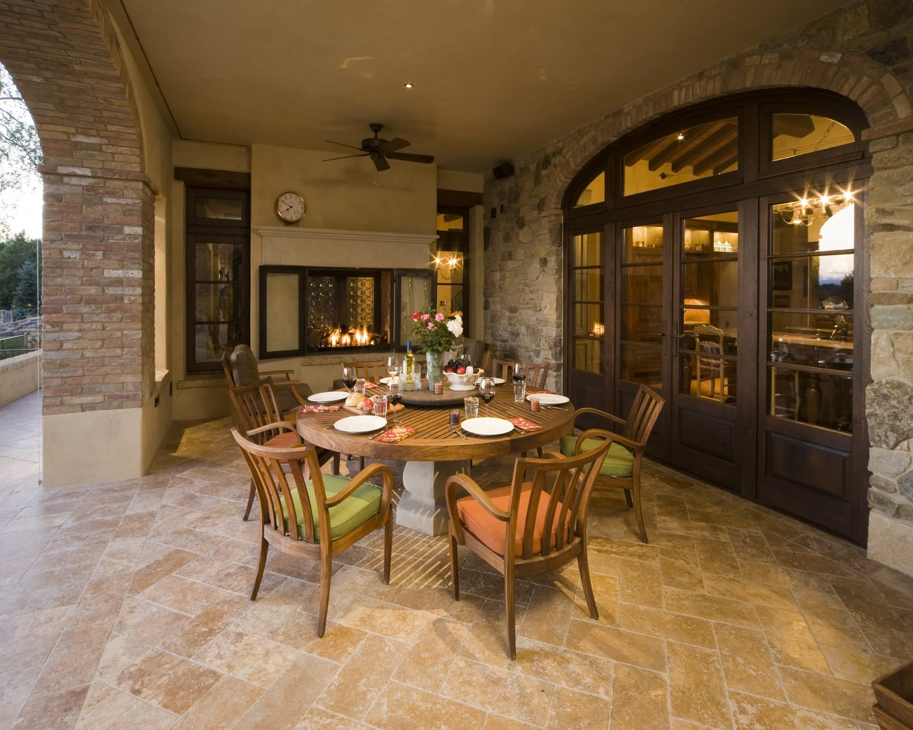 A patio with double European wood outswing doors and windows by Veranda View