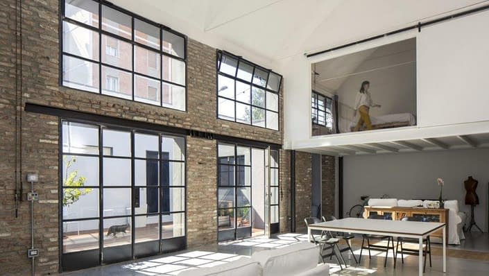 A loft accentuated by Vintage Steel's hot rolled steel doors