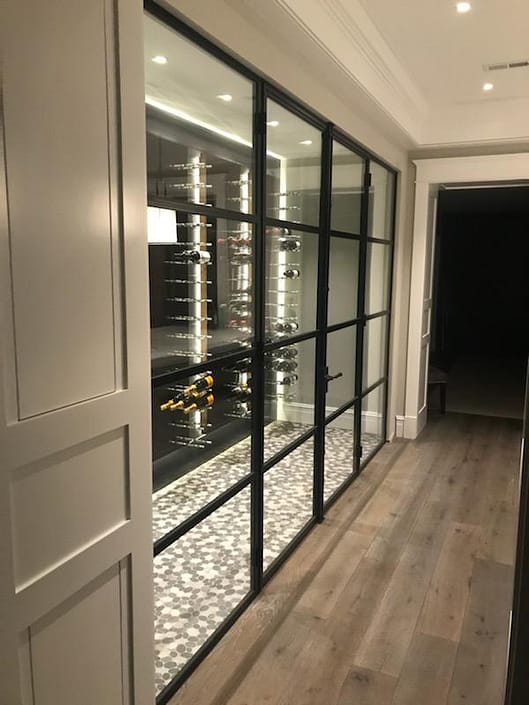 Custom steel wine cellar door system finished in black