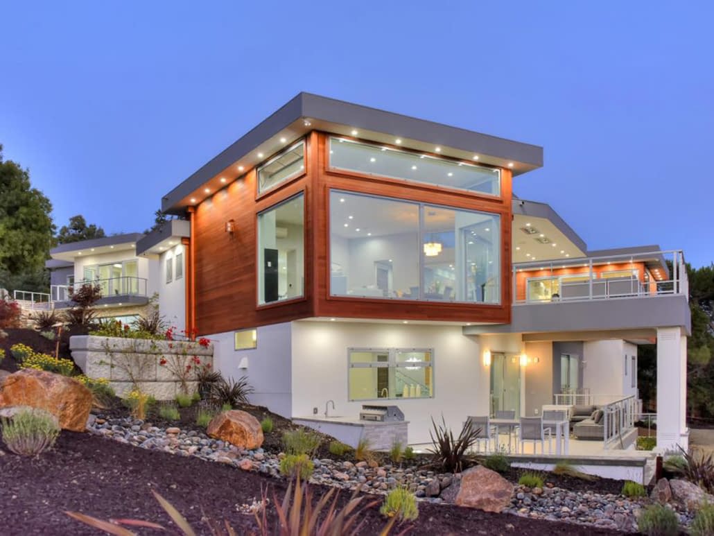 Custom aluminum window and door systems showcase this contemporary villa