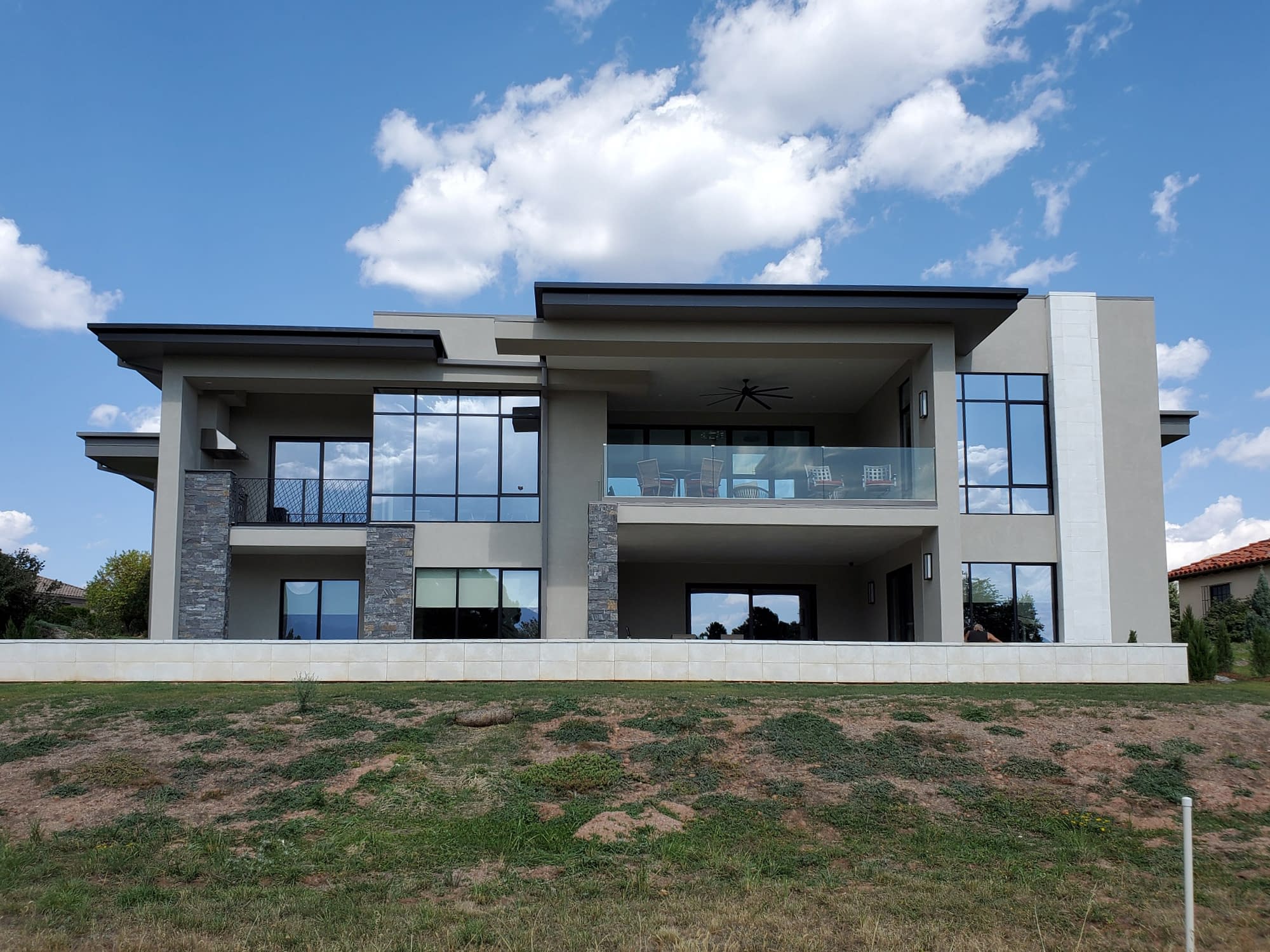 Floor to ceiling custom aluminum walls of window and doors are showcased in this Colorado home.