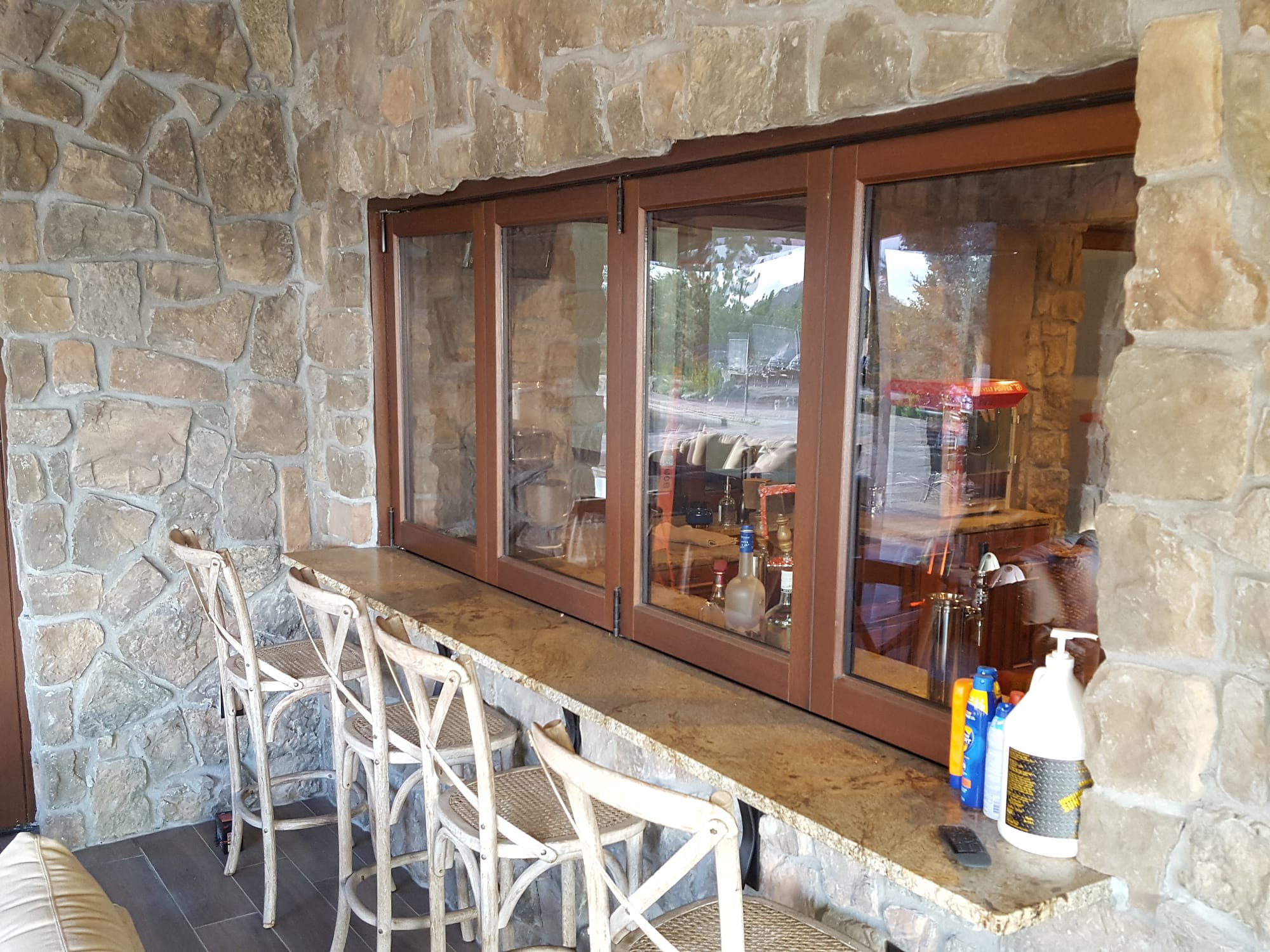 The patio bar features a four panel wood folding window