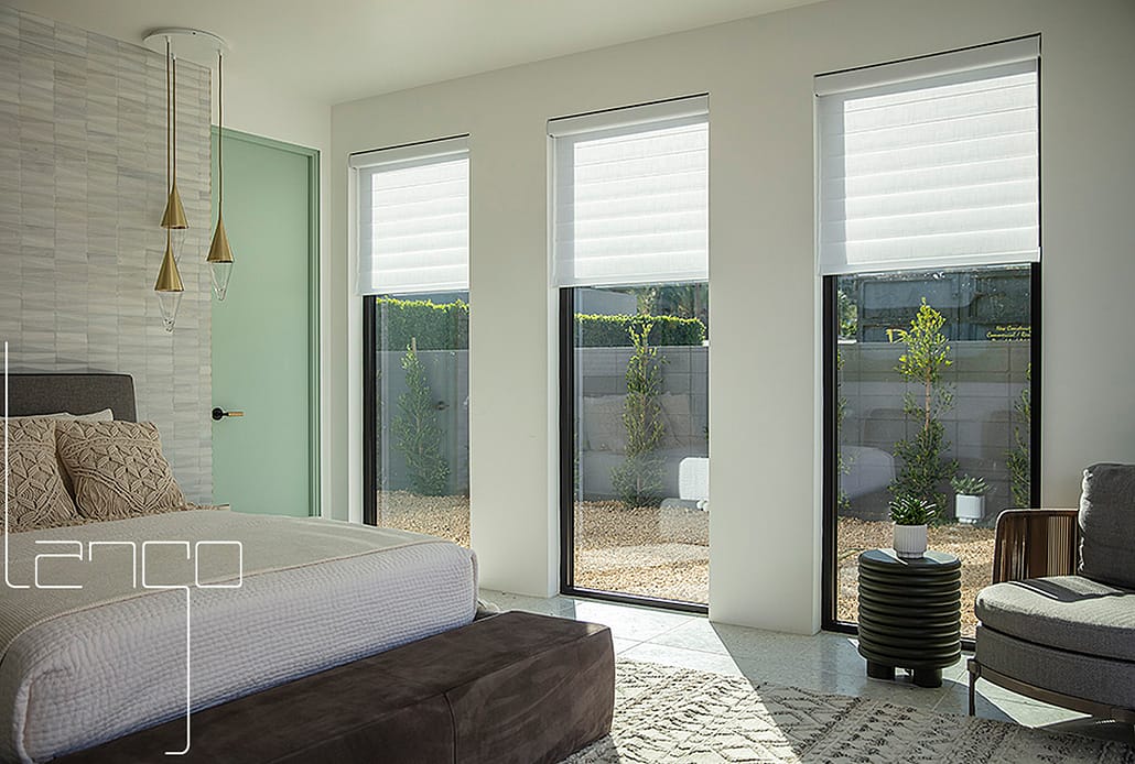 Natural light floods in this set of three fixed aluminum windows by SPI Finestre