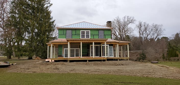 The installation of the all wood doors and double hung windows begins in this upstate New York estate.