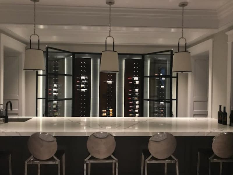 A wine cellar with double custom steel outswing doors