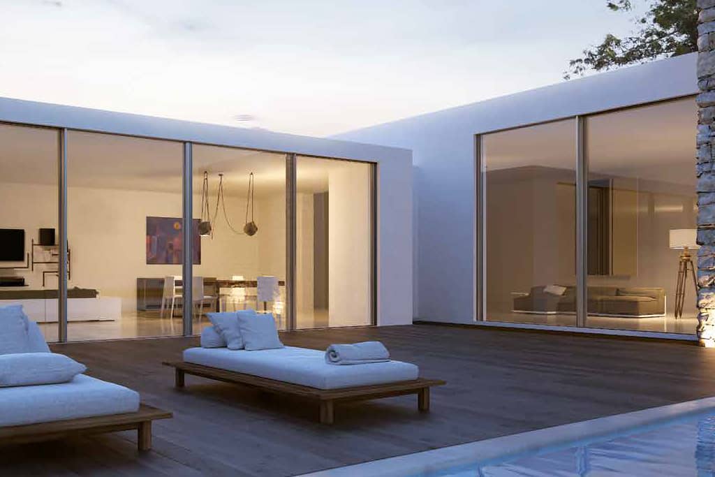 Expansive glass panels and the minimal frame lift/slide door systems open the living spaces to the outdoors