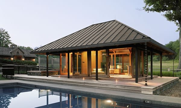A pool house with multiple custom lift slide door systems by Veranda View