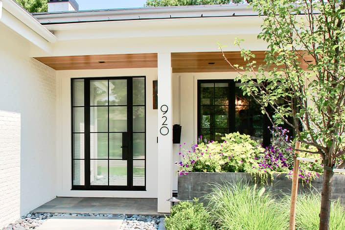 This thermally broken custom steel door by Vintage Steel completes the home's contemporary design.