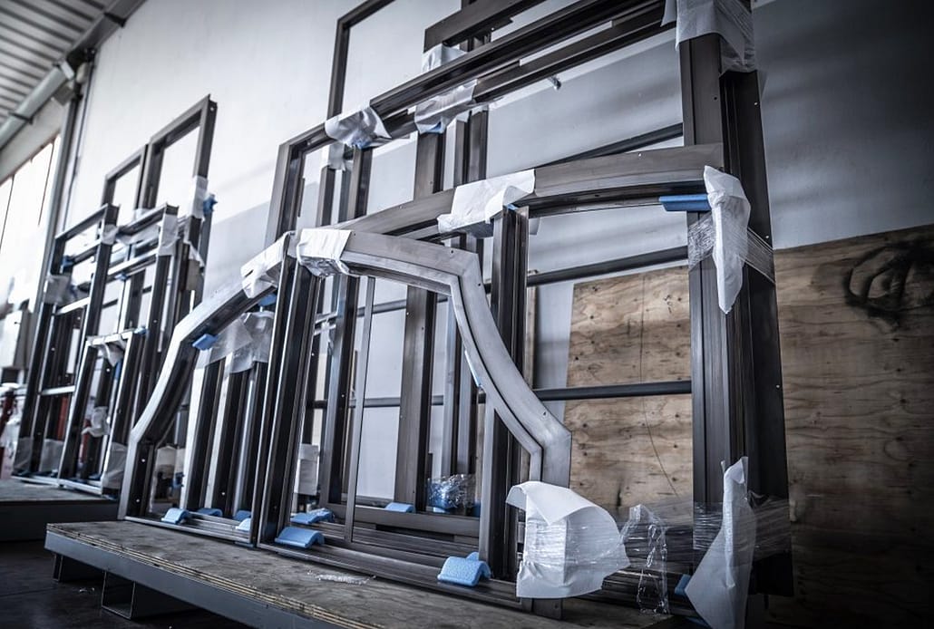 Steel window and door frames are securely stored while they wait for the next step