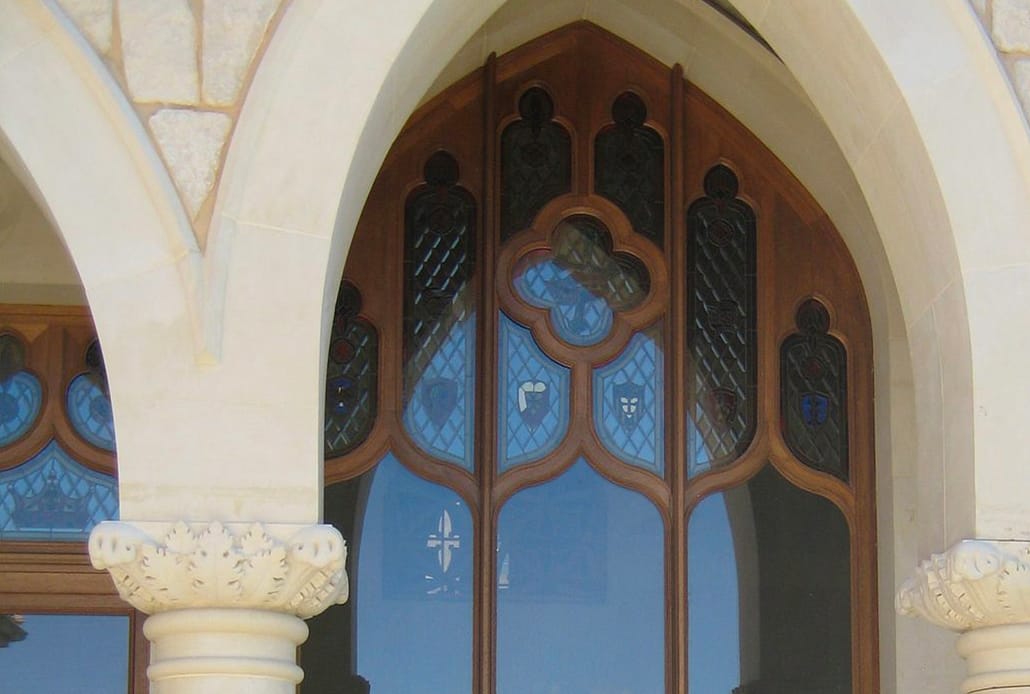 A historical restoration wooden gothic style window was designed to match the architectural style of the building