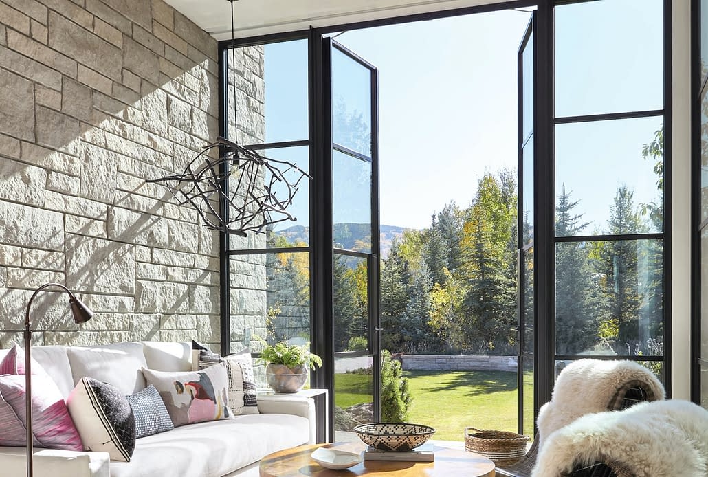 A double steel outswing door by Brombal brings the cool Aspen air into the sitting area