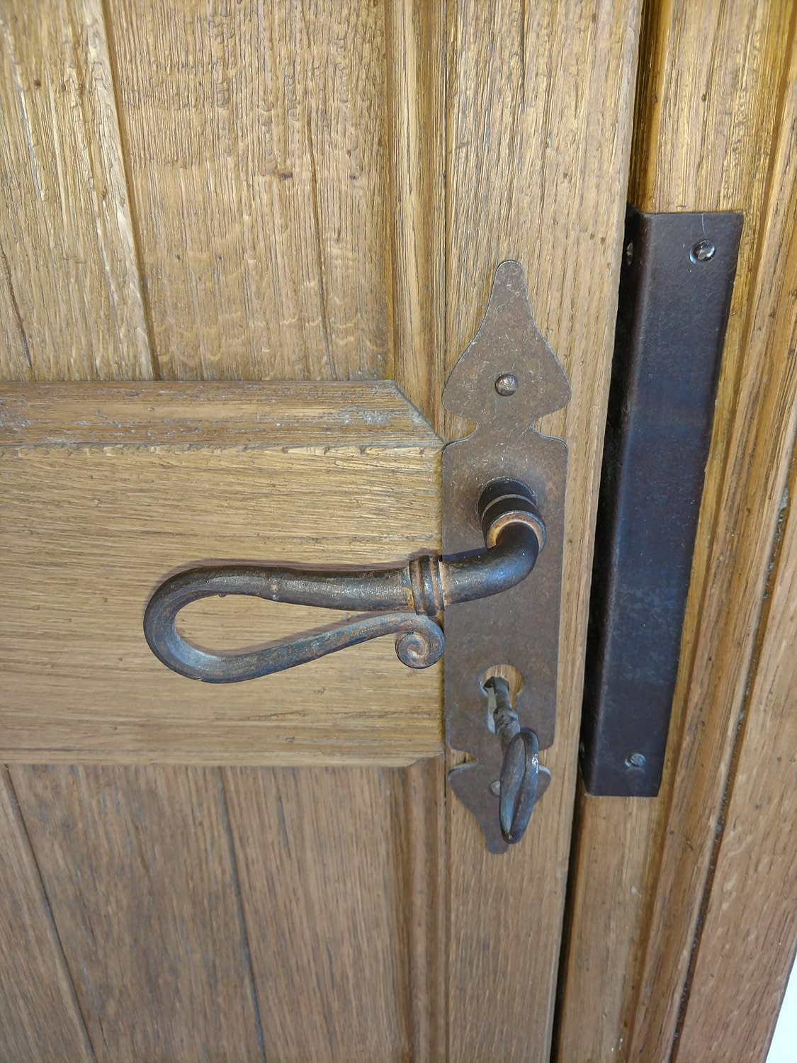 Detail of custom iron entryway hardware