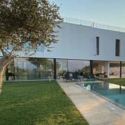 Minimal frame aluminum windows and door systems were used in this contemporary Italian villa for expansive views