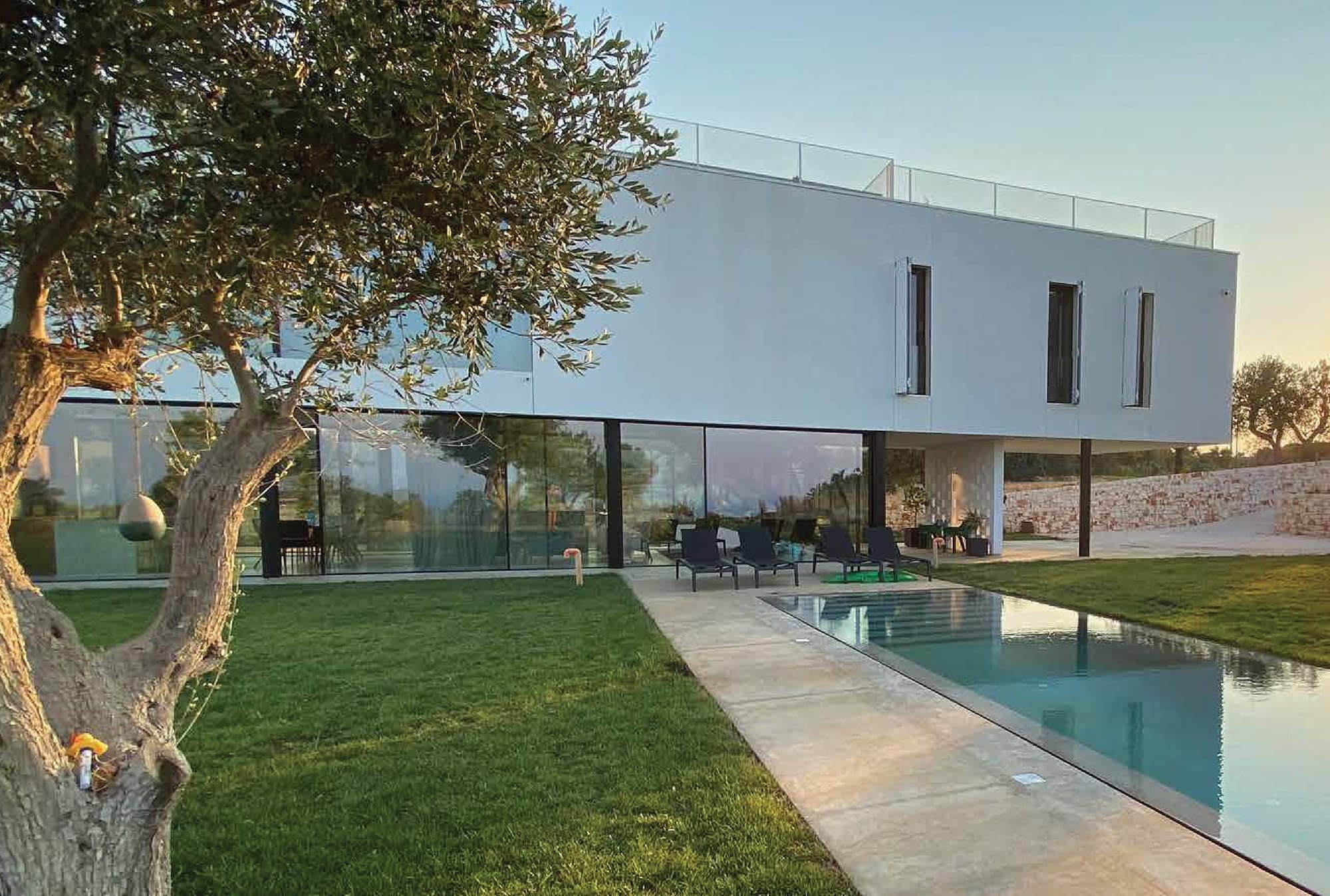 Minimal frame aluminum windows and door systems were used in this contemporary Italian villa for expansive views