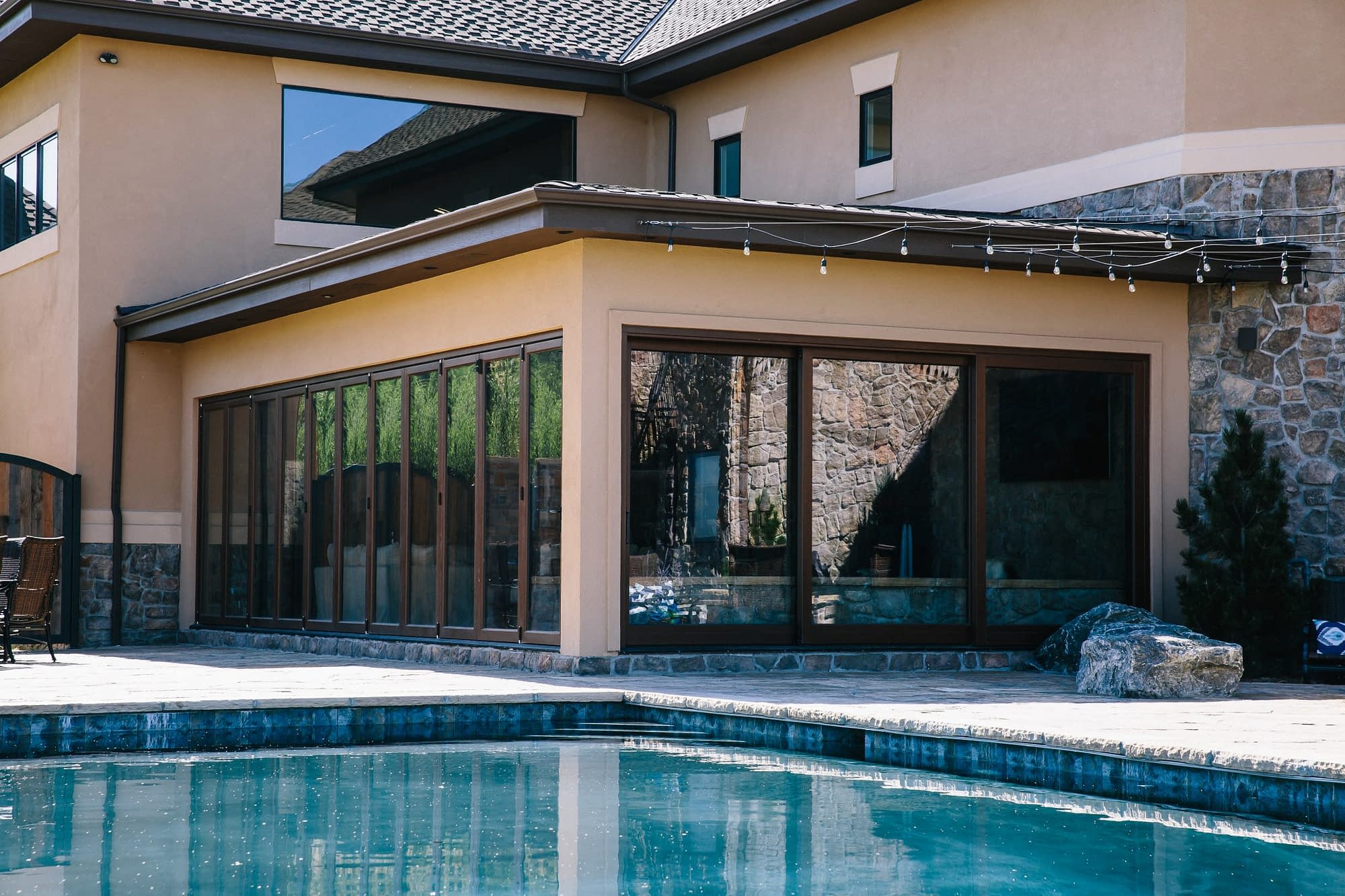 A folding door system and a lift slide door system combine to enclose a custom hot tub