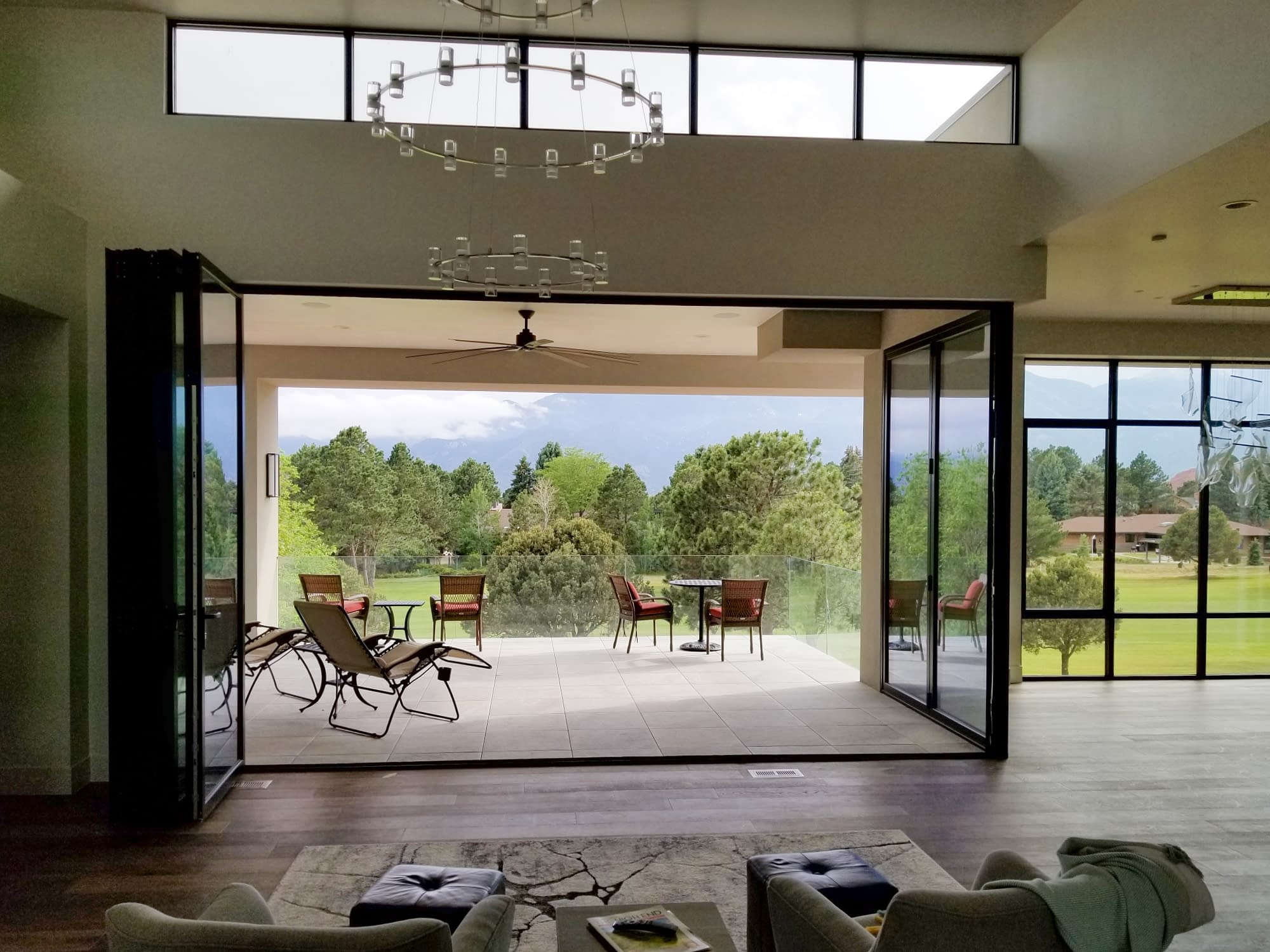The 5 panels of this aluminum folding door fully opens to the outdoor living space.