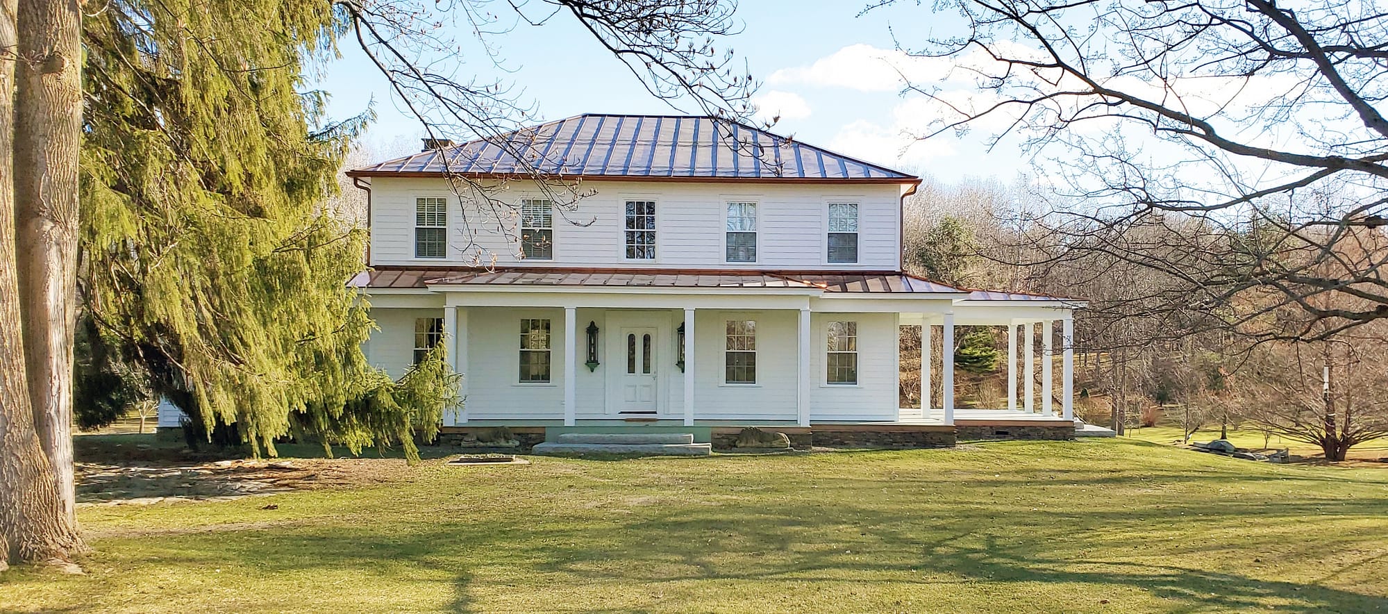 This classic farmhouse in upstate New York features all wood double hung windows and doors from Pinus.