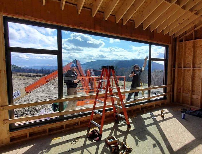 Our installation techs are making final adjustments to the custom oversized window in the Berkshires.
