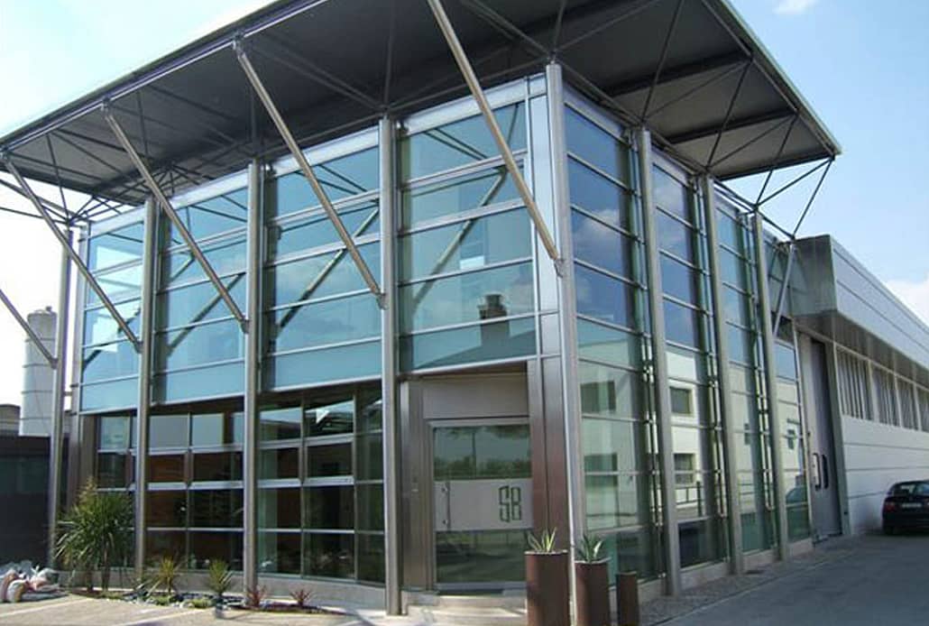 A stainless steel curtain wall is showcased at the front of the Brombal facility.