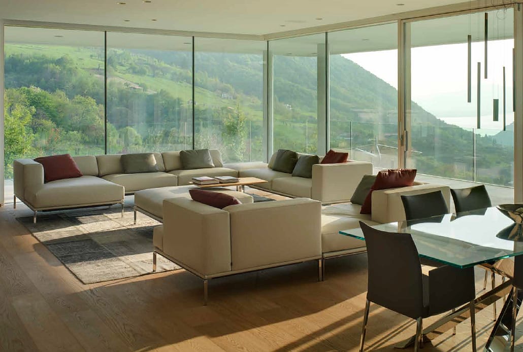 Oversized glass panels in this contemporary residence allow for breathtaking views of the surrounding landscape.