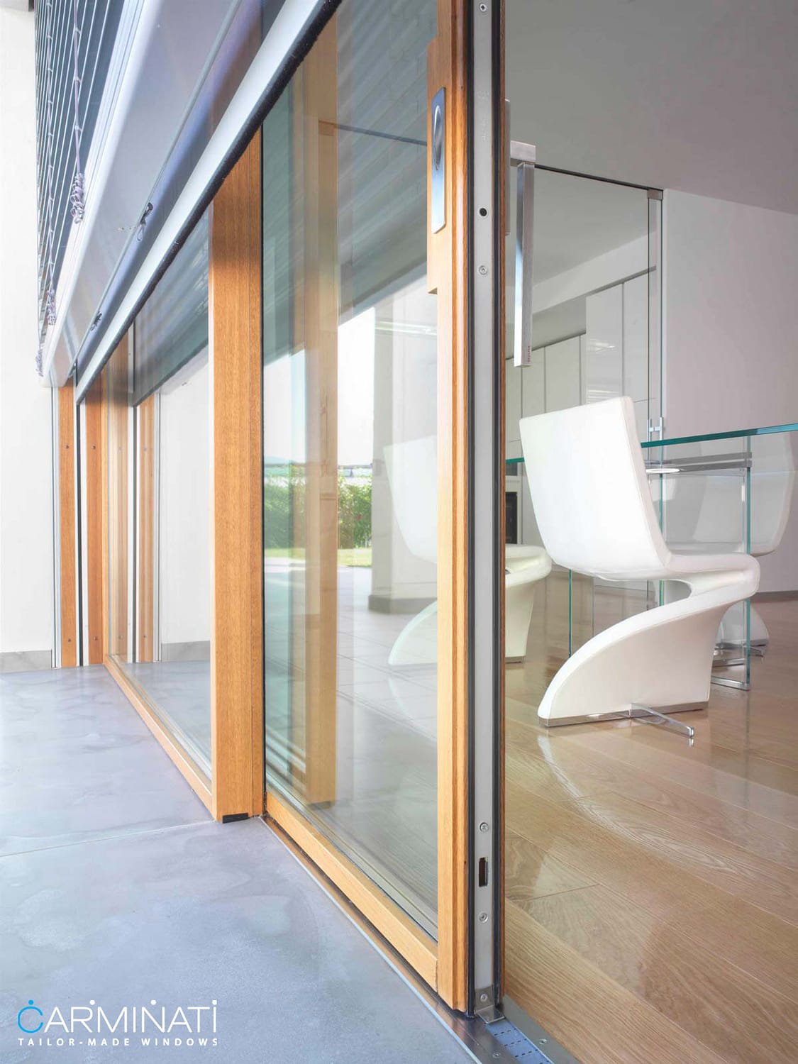 Carminati's Skyline minimal frame wood lift slide door system with embedded track