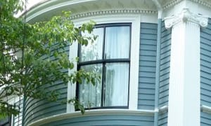 Curved double hung windows are painted black for a contemporary look.