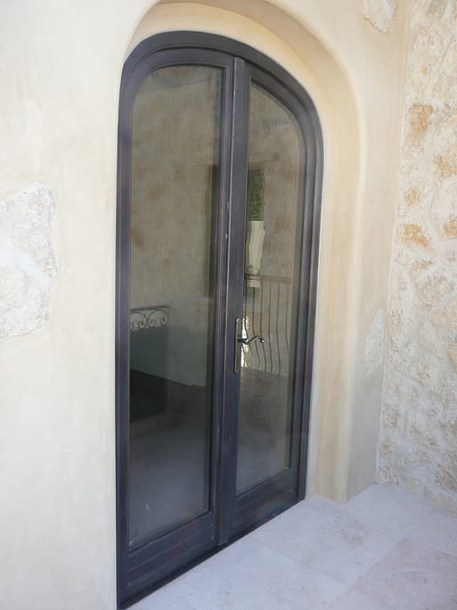 Double bronze outswing entryway door