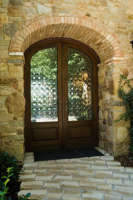 Custom European wood entryways with decorative glass by Veranda View