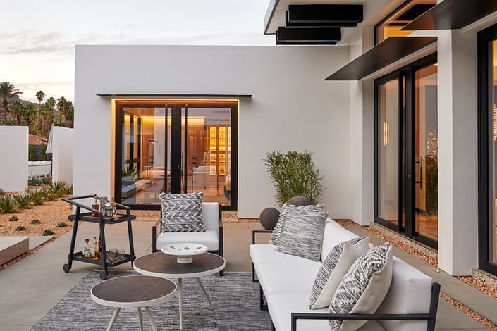 A Palm Springs villa constructed with elegant aluminum pivot doors by SPI Finestre
