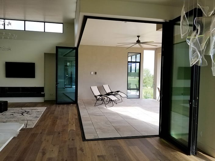 This corner meet aluminum folding door opens the home up to expand the living space to the outdoors.